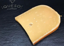 A slice of Gouda Cheese 168开奖官方开奖结果查询 幸运8官网开奖官方结果 直播历史记录查询 displayed on a black marble surface